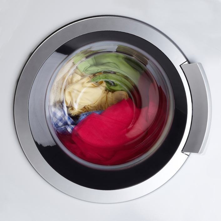 Clothes sitting in a closed washing machine