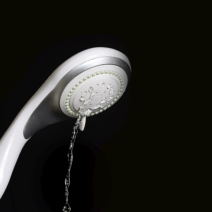 Water dripping from a modern shower head
